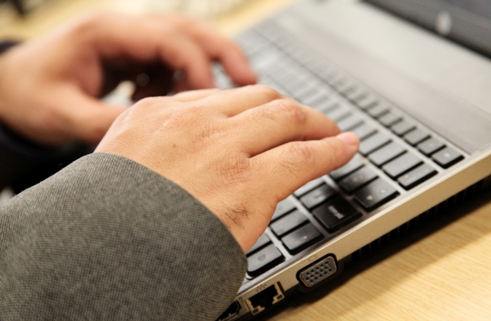 typing on laptop
